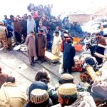 Miners gather outside a collapsed coalpit as rescue personnel search for trapped workers after a gas explosion in Balochistan province, Pakistan, on March 20, 2024