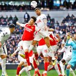 Arsenal's Takehiro Tomiyasu in action with Tottenham Hotspur's Cristian Romero in the Premier League match against Tottenham Hotspur.