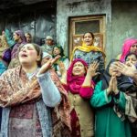 Family members and relatives cry after the boat capsized in Jhelum River.