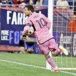 Inter Miami forward Lionel Messi (10) retrieves the ball from the net after scoring in the first half of an MLS soccer match against the New England Revolution, Saturday, April 27, 2024, in Foxborough, Mass.