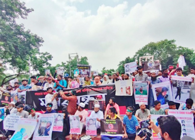 Members of the families of those killed during the student movement hold a rally at the Central Shaheed Minar on Wednesday